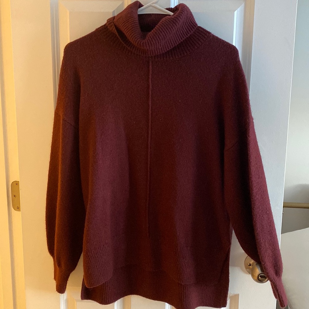 Soft burgundy turtle neck sweater with bishop sleeve
